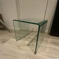 Side view of bent glass table showing thickness and condition