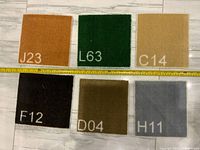 Six square carpet trivets positioned in two rows with measuring tape showing size