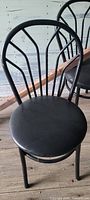 Single black metal chair front view