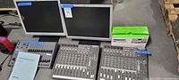 Overall lot view showing two mixers, two monitors and Belkin dock