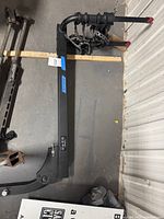 Overall view of hitch bike rack showing twin carry arms and receiver shank