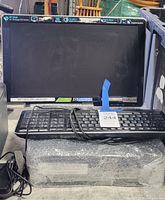 Overall view showing HP monitor, keyboard, desktop tower and cabling