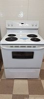Front view of Frigidaire electric stove showing four coil burners and control panel