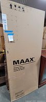 Front view of MAAX shower door box showing logo and product type