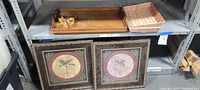 Full view of lot on shelf showing tray, baskets and two framed prints