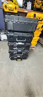 Stack of five black Pelican cases front view