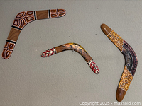 Overview of all three boomerangs showing size and paint patterns