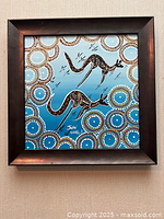 Front view of framed Indigenous kangaroo painting showing artwork, signature, and frame