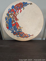 Front view showing Celtic artwork and drumhead condition