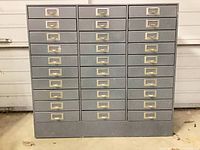 Front view of gray 30-drawer cabinet