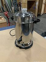 Full view of stainless steel Welbilt 60-cup coffee percolator with lid and spout