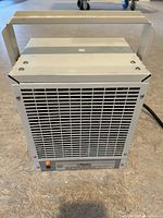 Front view of Dimplex heater with grille and indicator light