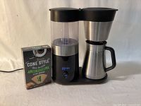 OXO coffeemaker with thermal carafe and box of #4 cone filters