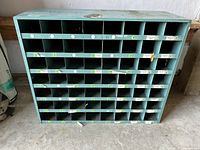 Front view showing all 56 compartments and labels