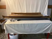 Both hand rails with boxes and packaging on table