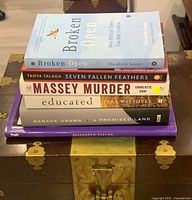 Stacked view of all six books showing spines