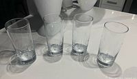 All four clear highball glasses side-by-side