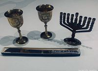 Menorah, two kiddush cups, knife in box