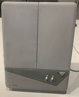 Mirror closed showing exterior case and control panel