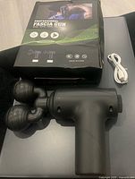 Massage gun, retail box, USB cable
