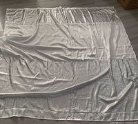 Entire curtain laid flat showing overall design and sequin placement