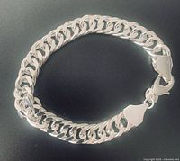 Bracelet coiled to show links and clasp