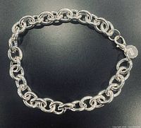 Bracelet arranged in circle showing full chain and links