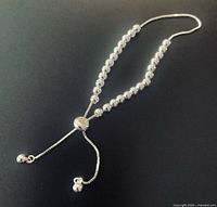 Full view of sterling silver bead bracelet laid flat