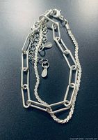 Both bracelets showing link styles, clasp and extender