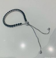 Bracelet laid in loop showing stones and bolo slider