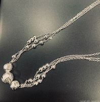 Close-up of central beaded section and chains