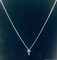 Necklace displayed on black background showing full length and pendant