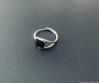 front view of sterling silver ring showing black square setting
