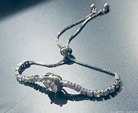 Full view of sterling silver adjustable tennis bracelet with CZ stones