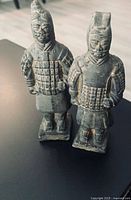 Front view of both terracotta warrior figurines