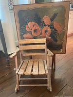 Rocking chair in front of folding table showing relative size and design