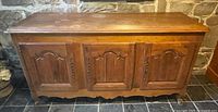 Front view of sideboard closed showing carved doors, scalloped apron, cabriole legs