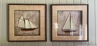Both framed sailboat pictures side by side