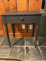 Front view of painted wood side table