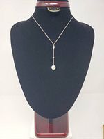 Full view of sterling silver Y-drop necklace on display bust