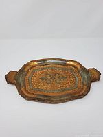 Top view of Florentine wooden tray showing shape, handles and decoration