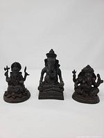 Front view of the three bronze Ganesh statues