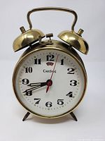 Front view of brass-tone Cardinal twin-bell alarm clock