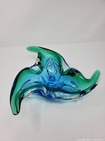 Overall view of tri-lobed blue-green art glass bowl