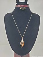 Full view of pendant on chain displayed on bust