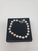 Full view of bracelet on gift box showing bead arrangement