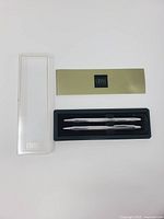 full set: pen, pencil, case, booklet