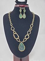 Full view necklace on bust with matching earrings