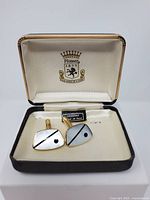 Open box showing both cufflinks and Pioneer logo