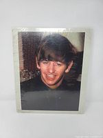 Front view of the colour Ringo Starr photo sealed in shrink wrap